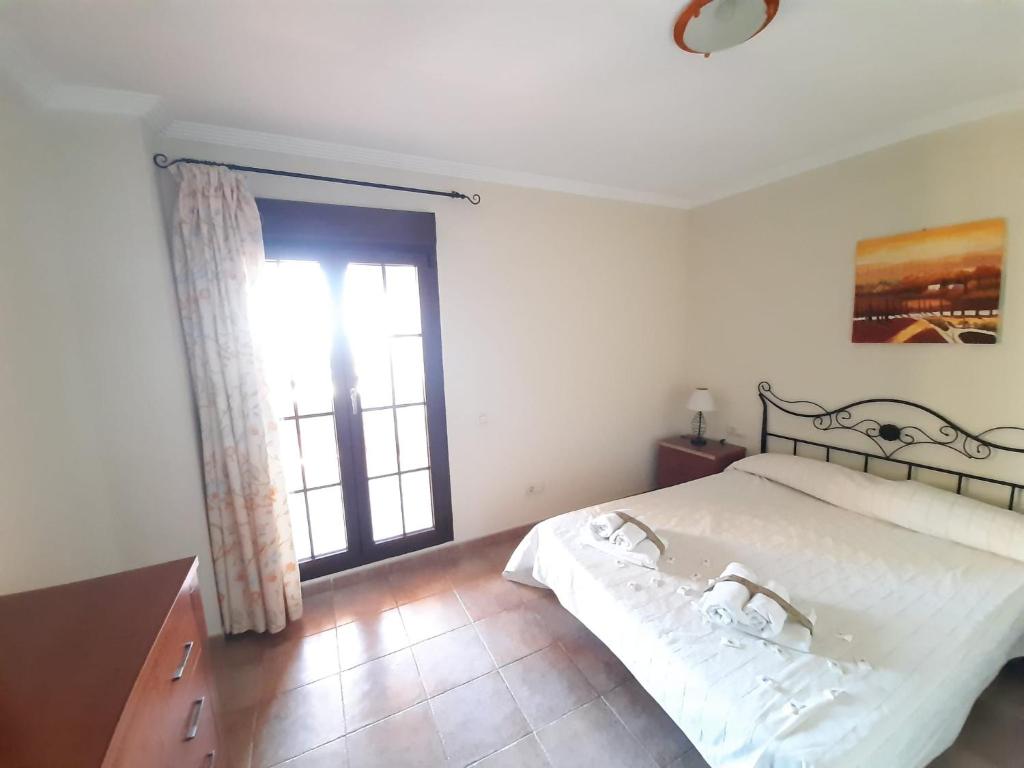 Posteľ alebo postele v izbe v ubytovaní APARTAMENTO 2 DORMITORIOS.URB PLAYA VERDE