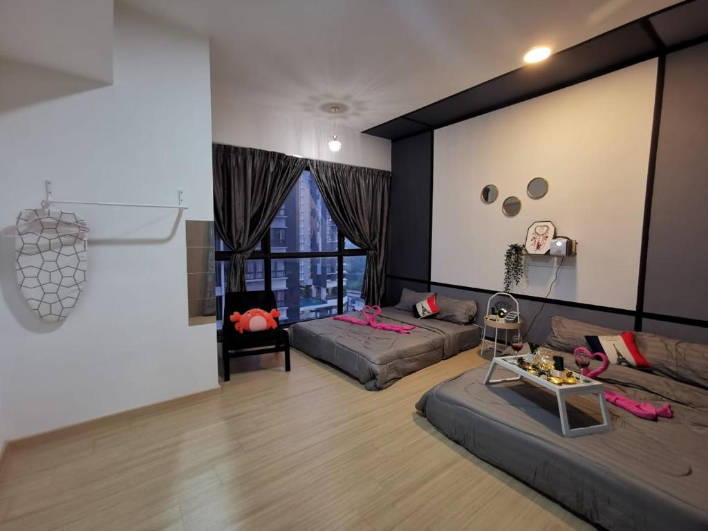 a living room with a couch and a table at DS13 Dsara 50inch 4k tv Netflix mrt next SB Hospital in Sungai Buluh