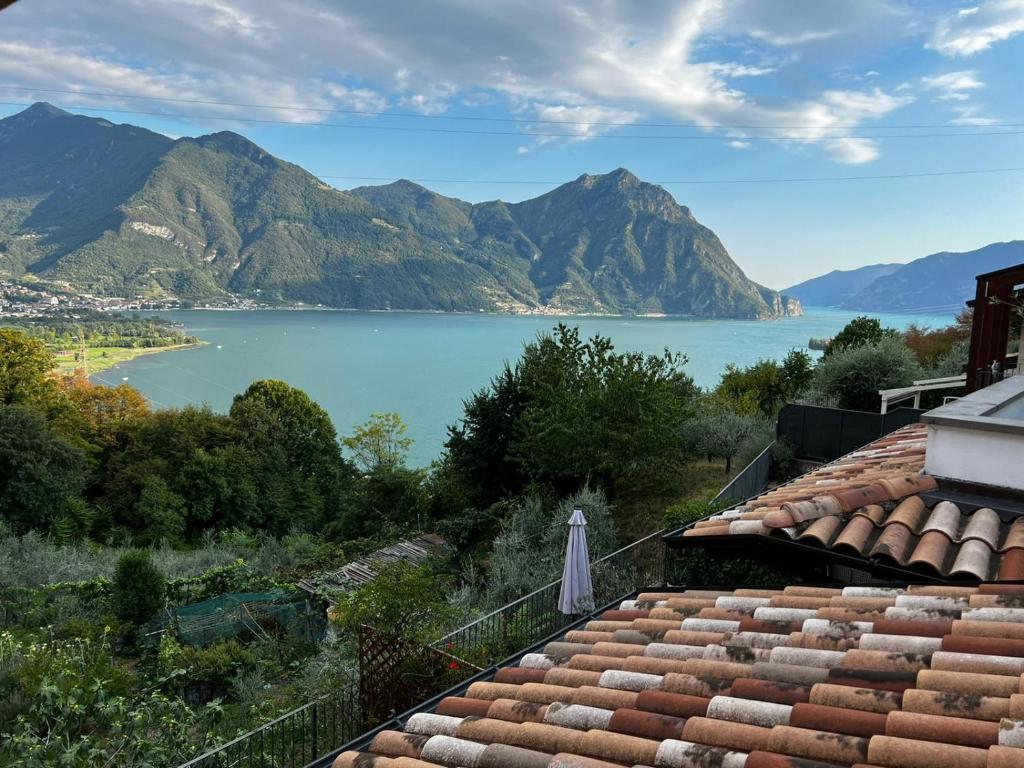 a view of a lake from the roof of a house at Iseo Lake Villa con vista lago e piscina in Costa Volpino