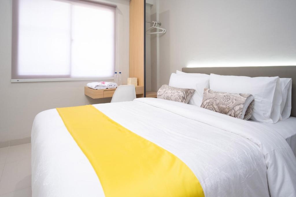 Postel nebo postele na pokoji v ubytování S101 Hotels