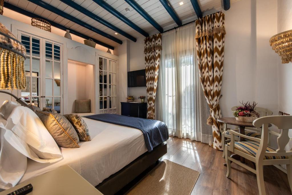 Posteľ alebo postele v izbe v ubytovaní Hotel La Malvasía