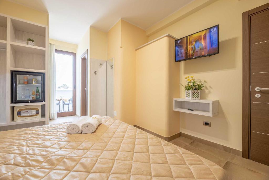 Postel nebo postele na pokoji v ubytování Hotel Salento Mirfran
