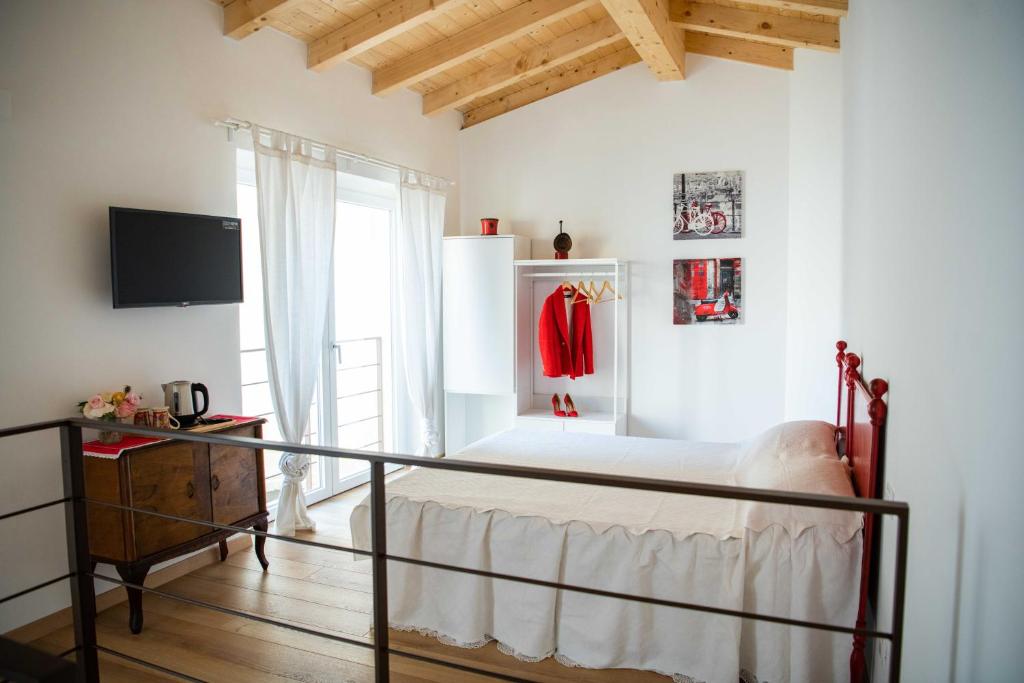 Postel nebo postele na pokoji v ubytování Corte Torchio B&B