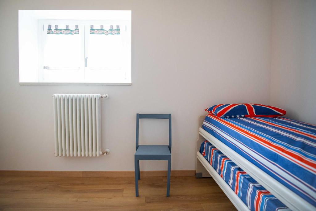 Postel nebo postele na pokoji v ubytování Corte Torchio B&B