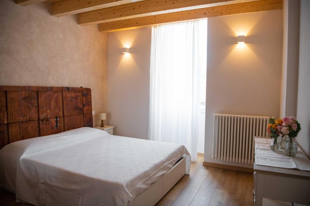 Postel nebo postele na pokoji v ubytování Corte Torchio B&B