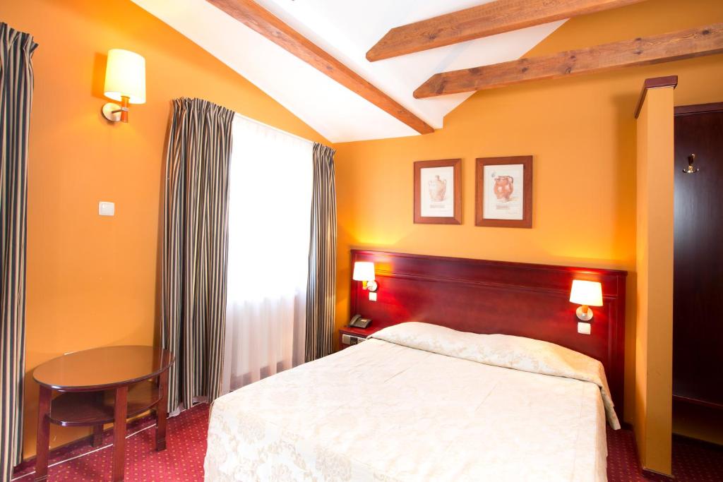 Ein Bett oder Betten in einem Zimmer der Unterkunft Meduza Hotel &amp; Spa