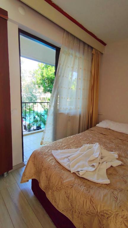 Postel nebo postele na pokoji v ubytování Artemis Yörük Hotel - Pamukkale Denizli