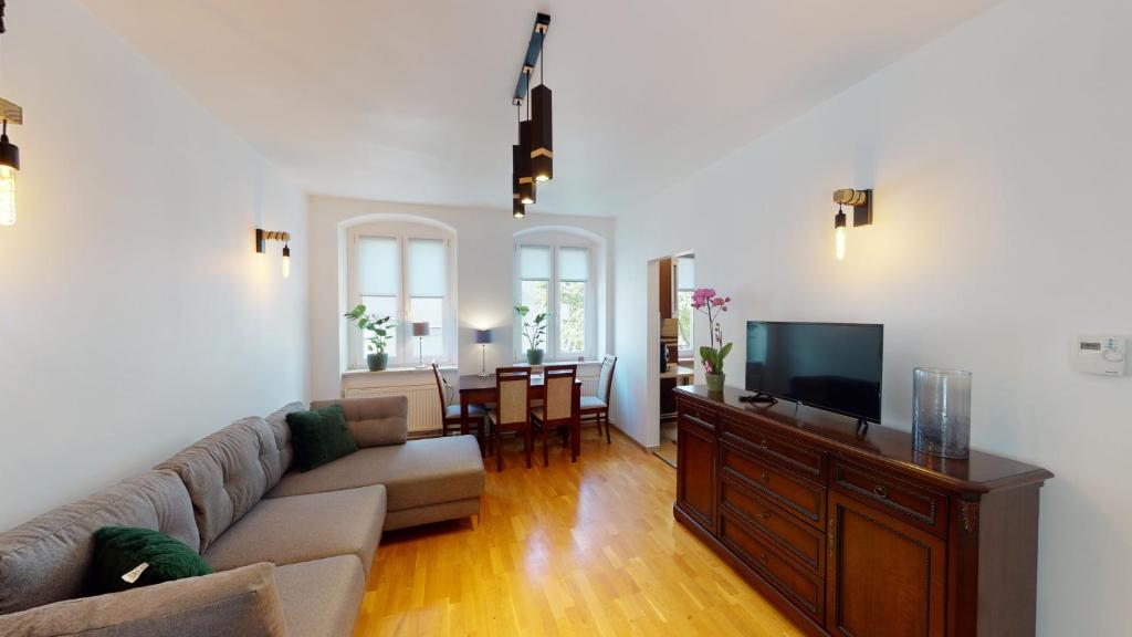 Televízia a/alebo spoločenská miestnosť v ubytovaní Paulinska 10 Tectum Apartments