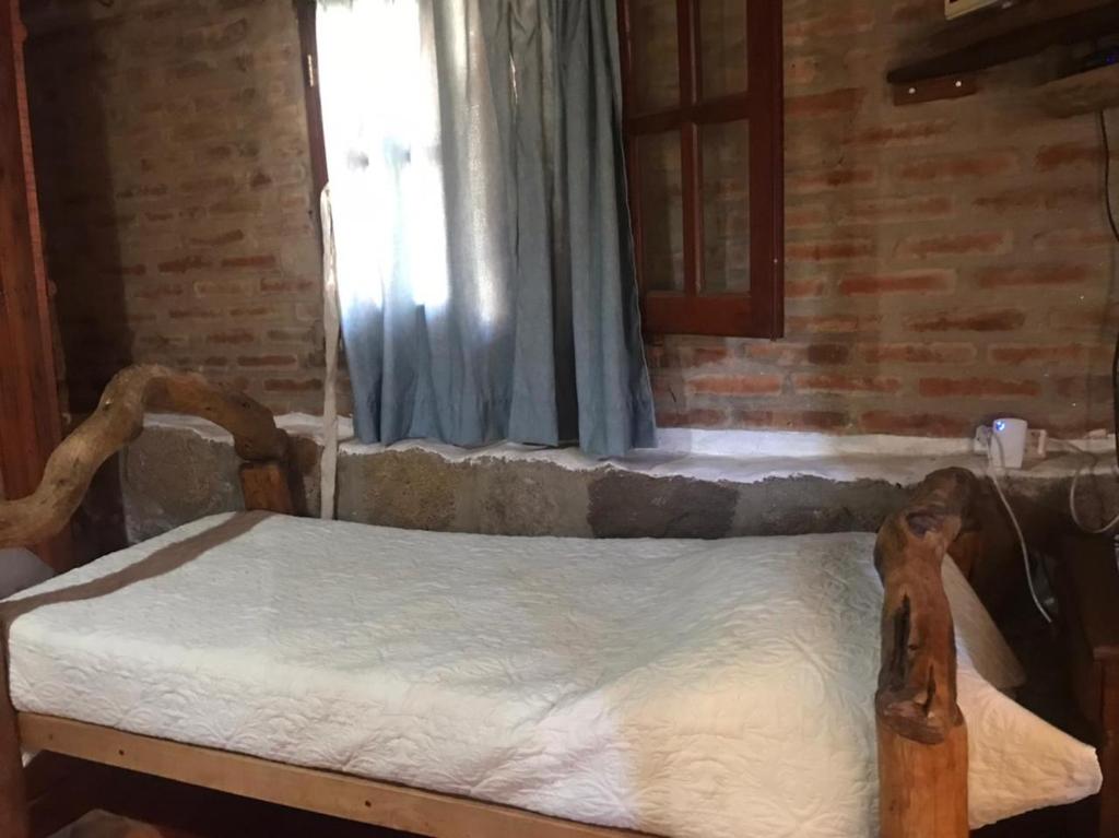 Postel nebo postele na pokoji v ubytování Pachamama cabañas en la montaña