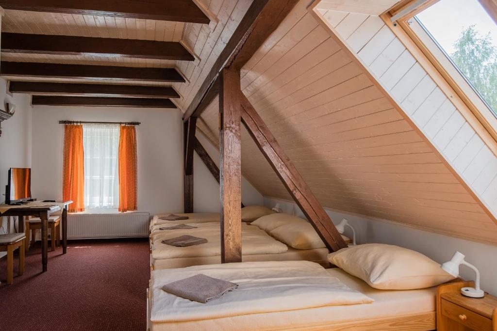 Postel nebo postele na pokoji v ubytování Pension Herman