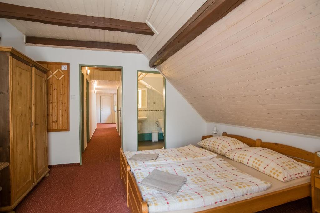 Postel nebo postele na pokoji v ubytování Pension Herman