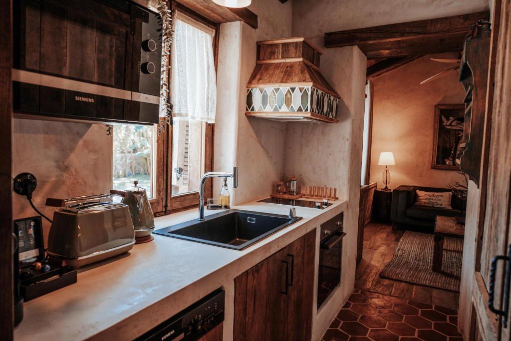 a kitchen with a sink and a counter top at Ada Dreams History - Adults Only in Fethiye