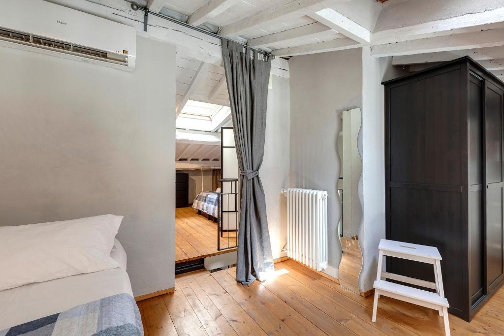 Łóżko lub łóżka w pokoju w obiekcie Zita Apartment by Mamo Florence