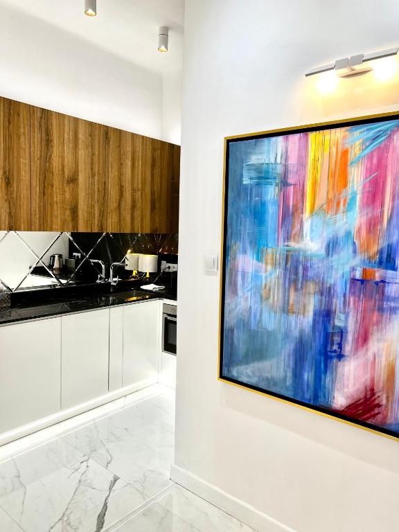 Kuchyň nebo kuchyňský kout v ubytování MONDRIAN Luxury Suites UNESCO Old Town