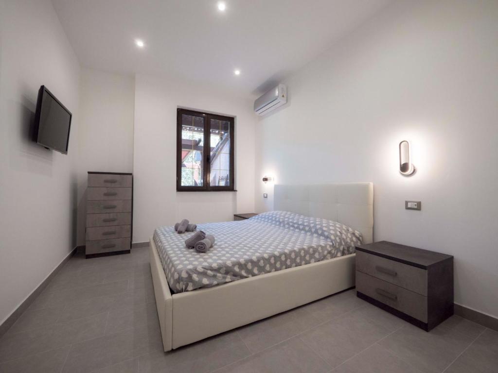 A bed or beds in a room at Villa Lisa casa vacanze