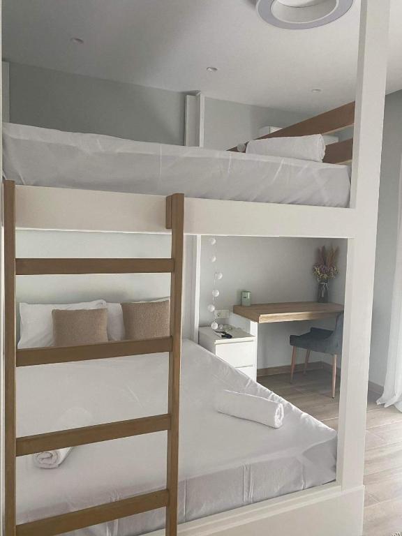 Łóżko lub łóżka w pokoju w obiekcie Villa Massari