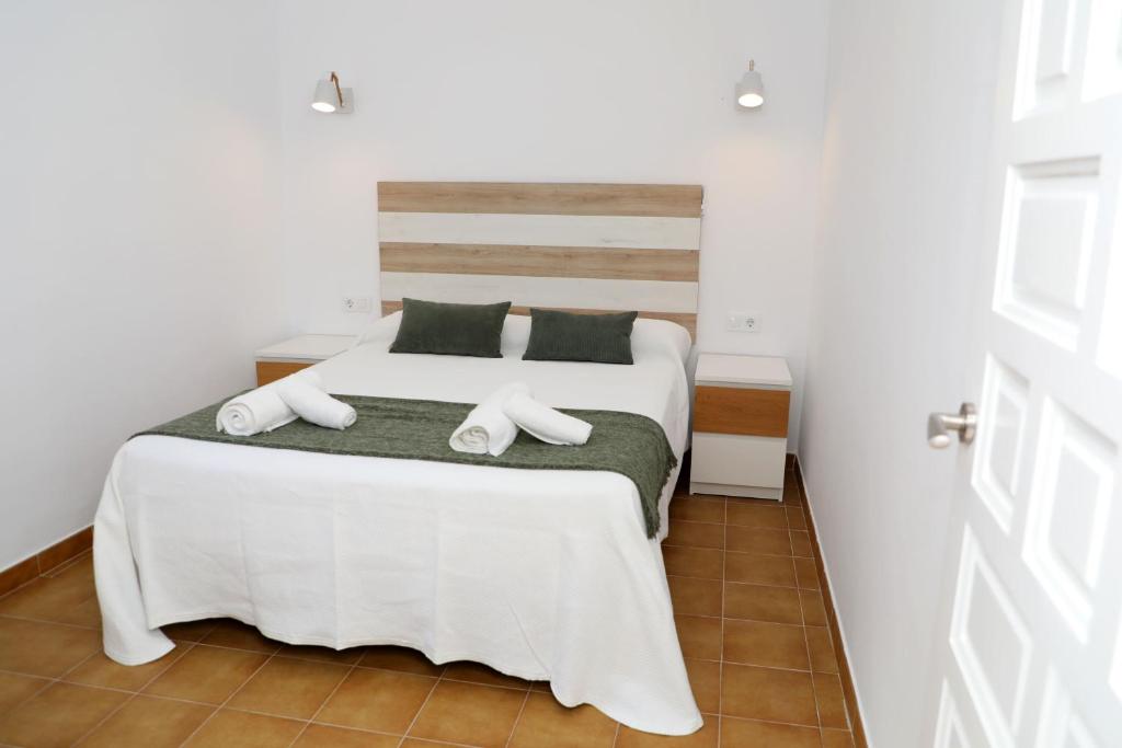 Łóżko lub łóżka w pokoju w obiekcie Casa La Herradura 2