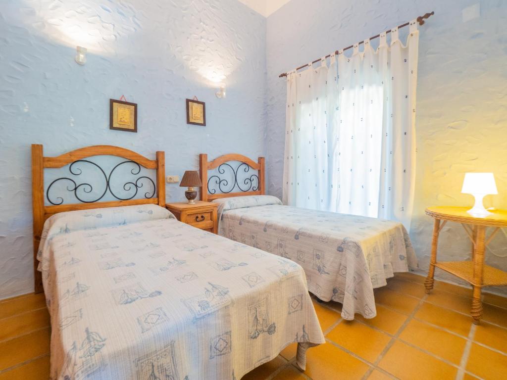 Postel nebo postele na pokoji v ubytování Cubo's Finca La Fuente del Pedregal Casa 3