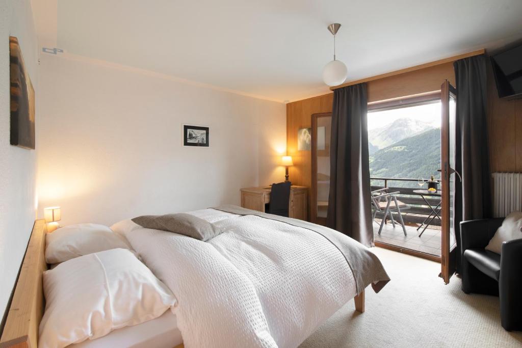 Postel nebo postele na pokoji v ubytování Hotel le Beausite