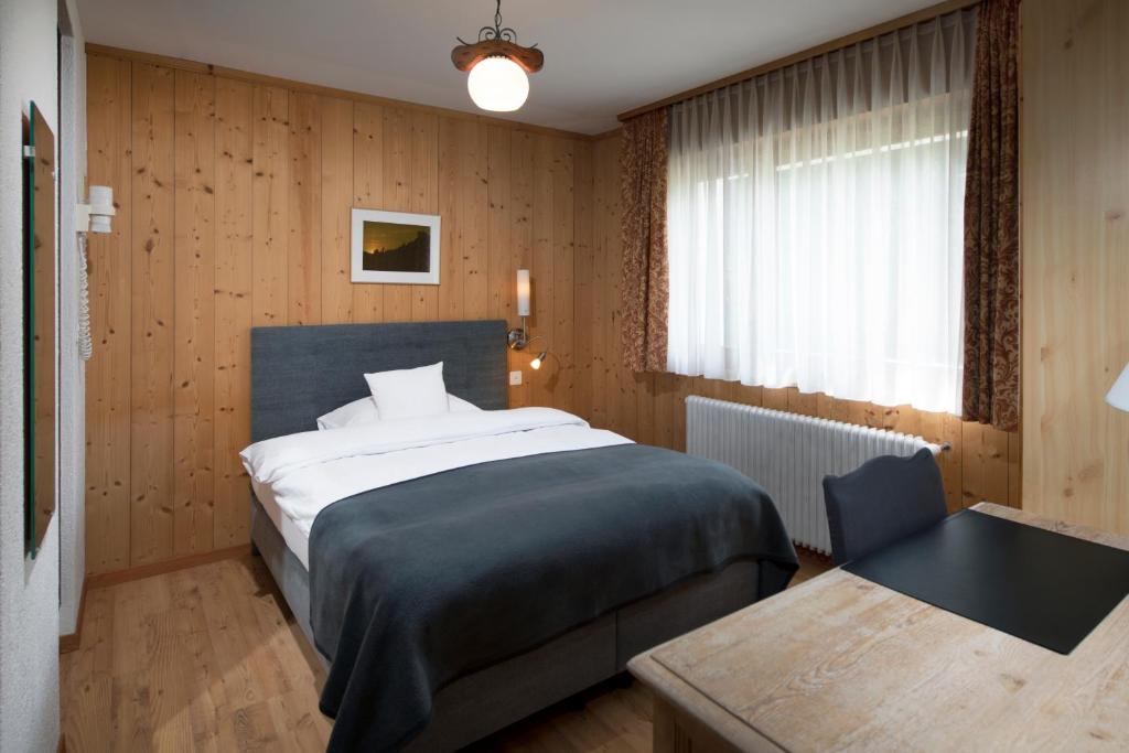 Postel nebo postele na pokoji v ubytování Hotel le Beausite