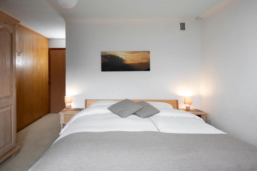 Postel nebo postele na pokoji v ubytování Hotel le Beausite