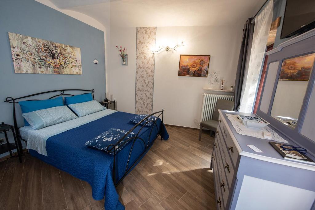 Postel nebo postele na pokoji v ubytování IL CORTILETTO 2