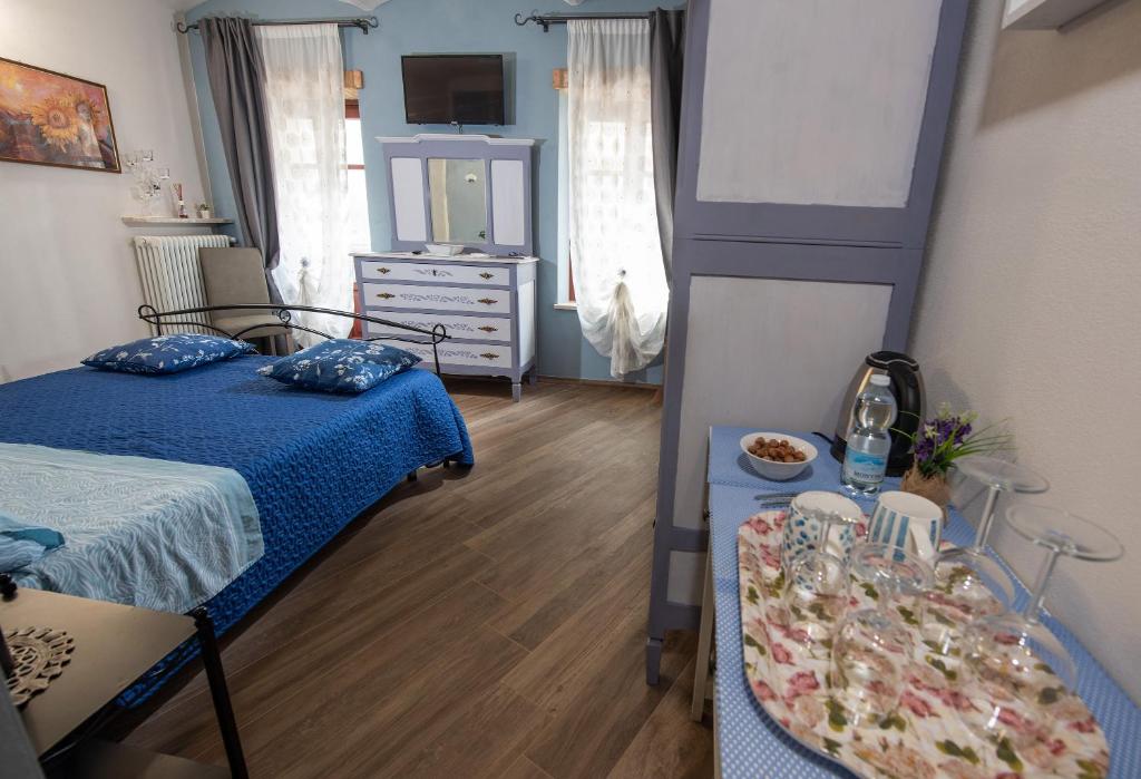 Postel nebo postele na pokoji v ubytování IL CORTILETTO 2