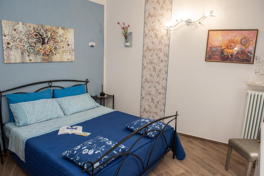 Postel nebo postele na pokoji v ubytování IL CORTILETTO 2