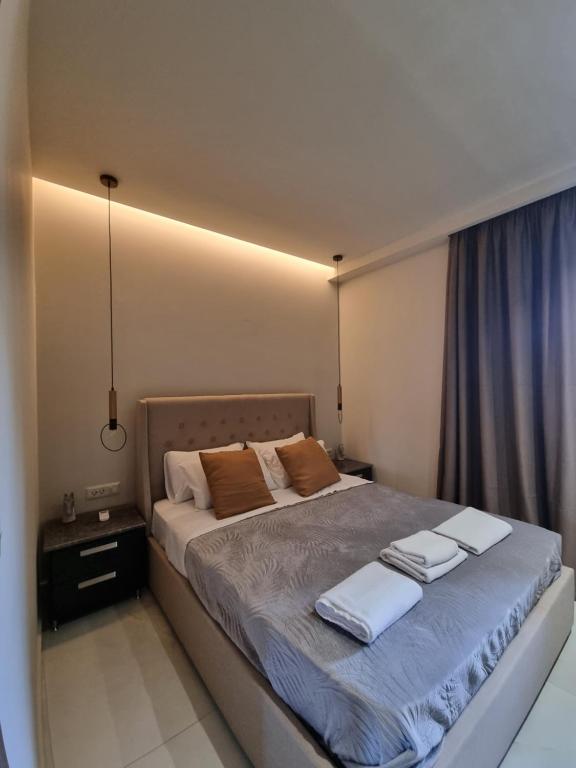 Posteľ alebo postele v izbe v ubytovaní Fiorzakynthos City Apartments