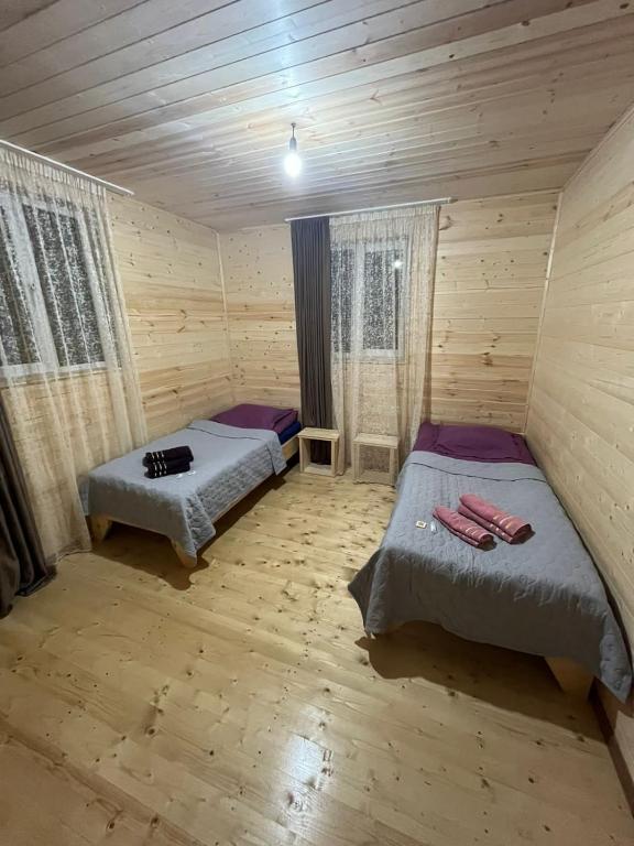 Postel nebo postele na pokoji v ubytování guest house caucasioni