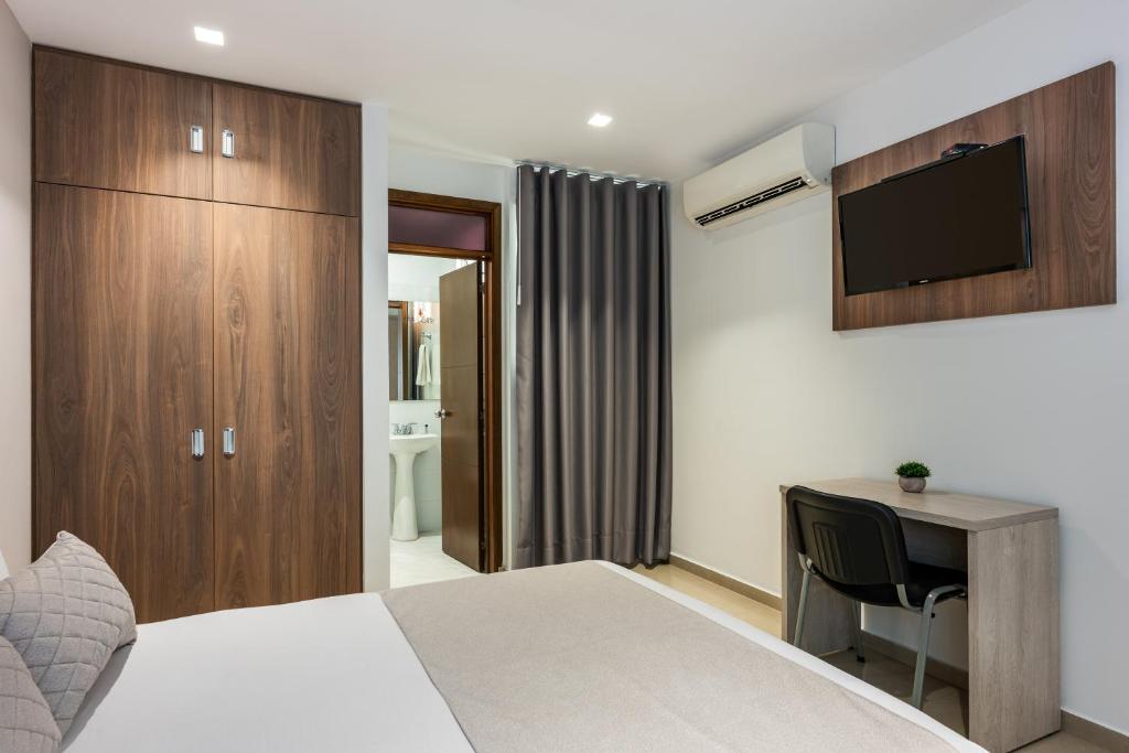 Postel nebo postele na pokoji v ubytování Hotel Elite
