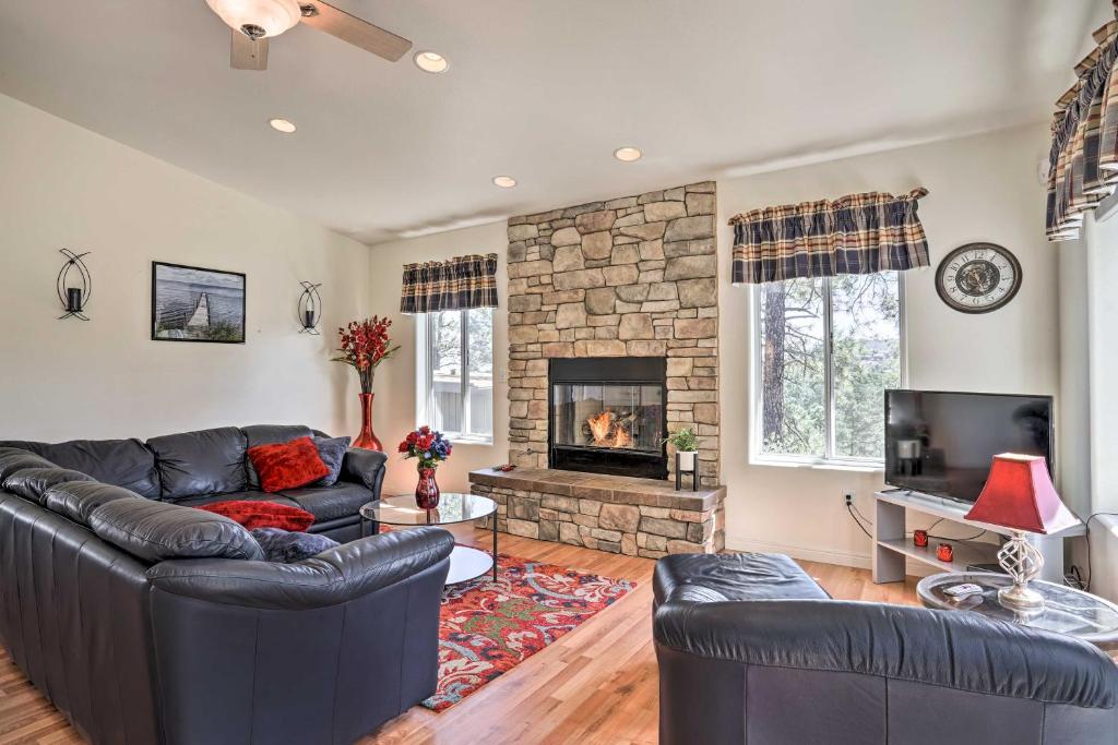 a living room with a couch and a fireplace at Secluded Prescott Home Less Than 2 Mi to Whiskey Row! in Prescott