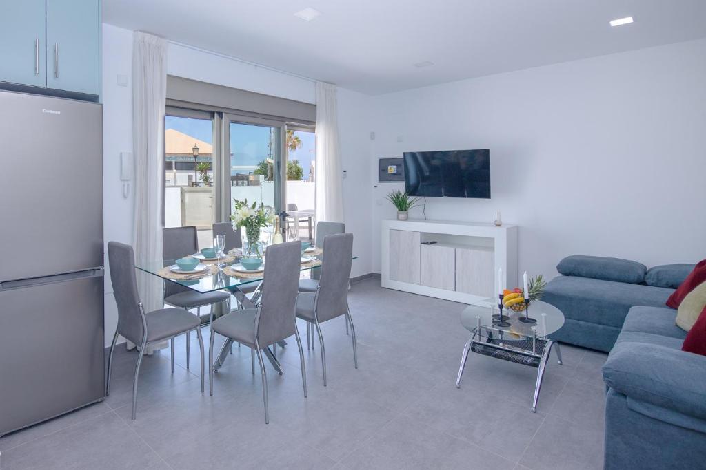 A seating area at Poris 3 Beachfront Corralejo By Holidays Home