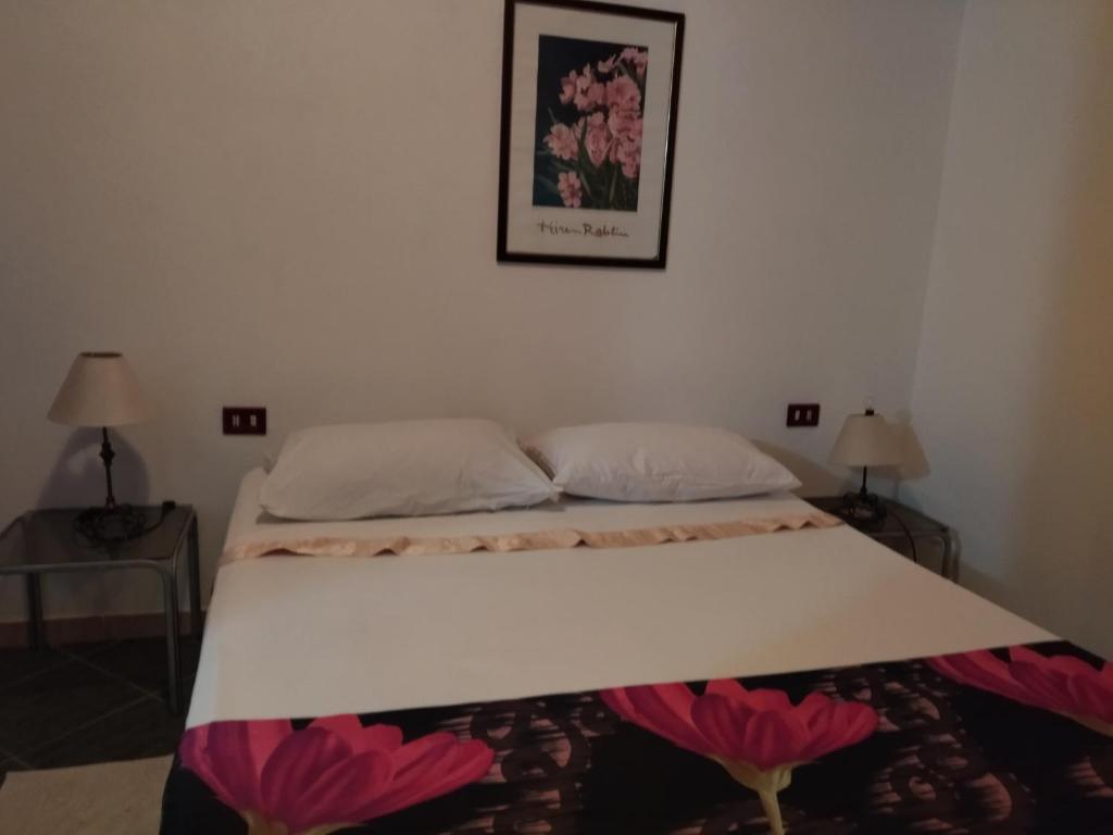 Posteľ alebo postele v izbe v ubytovaní Casa Leonardo