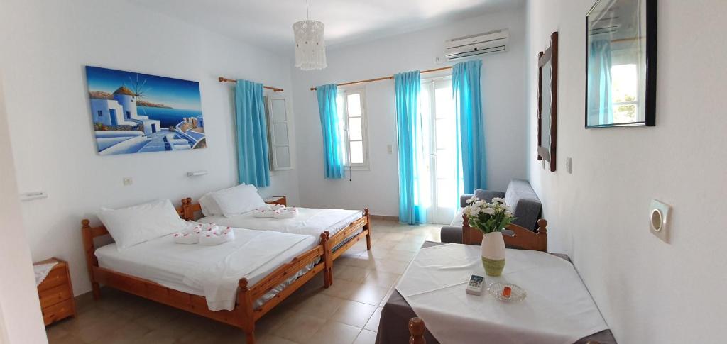 Postel nebo postele na pokoji v ubytování Jenny Apartments