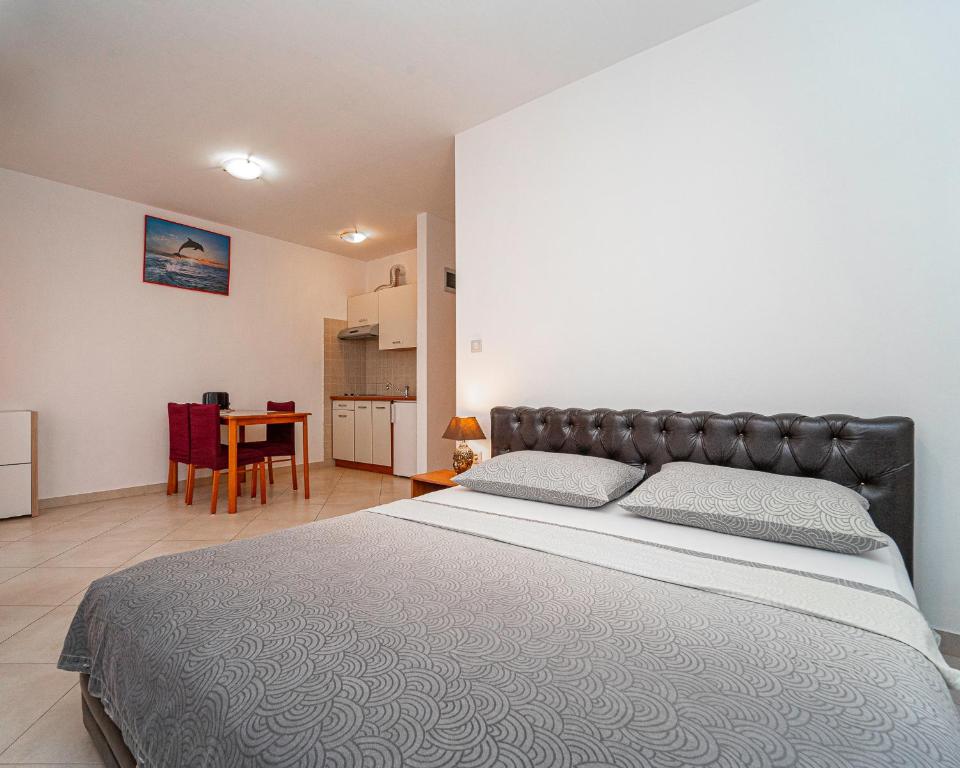Postel nebo postele na pokoji v ubytování Apartments Baresic
