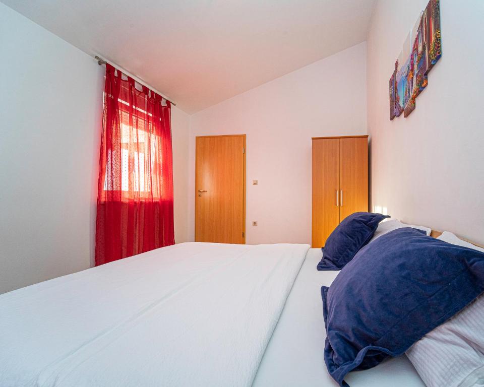 Postel nebo postele na pokoji v ubytování Apartments Baresic
