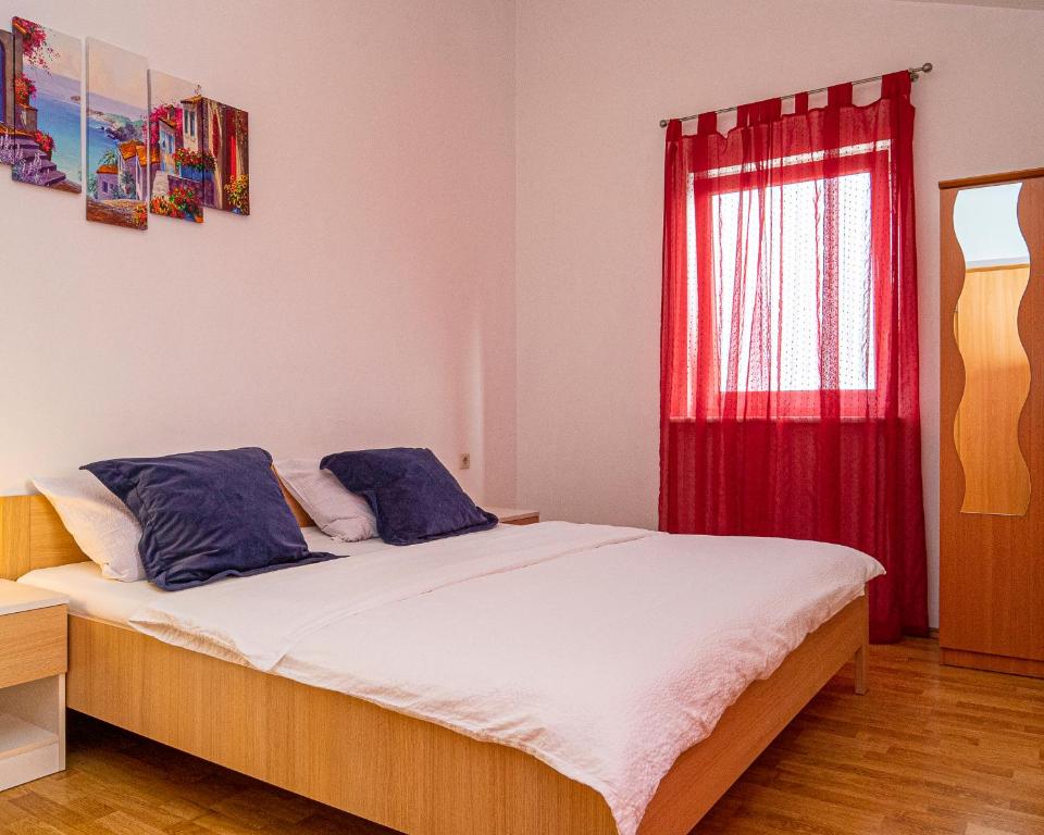 Postel nebo postele na pokoji v ubytování Apartments Baresic