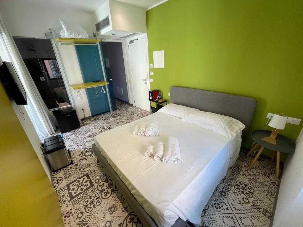 Łóżko lub łóżka w pokoju w obiekcie Gaias Rooms
