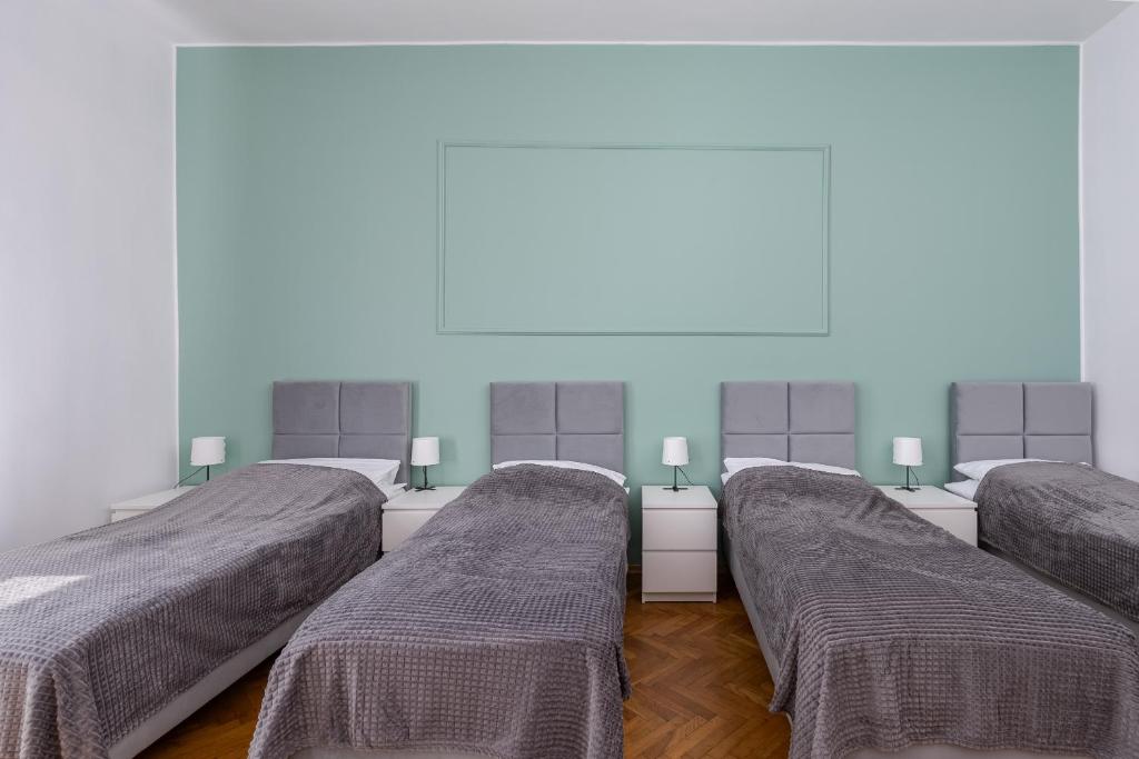 Posteľ alebo postele v izbe v ubytovaní Brzozowa Apartments by Hostly