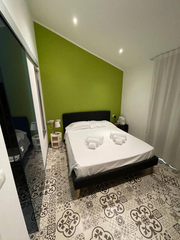 Łóżko lub łóżka w pokoju w obiekcie Gaias Rooms