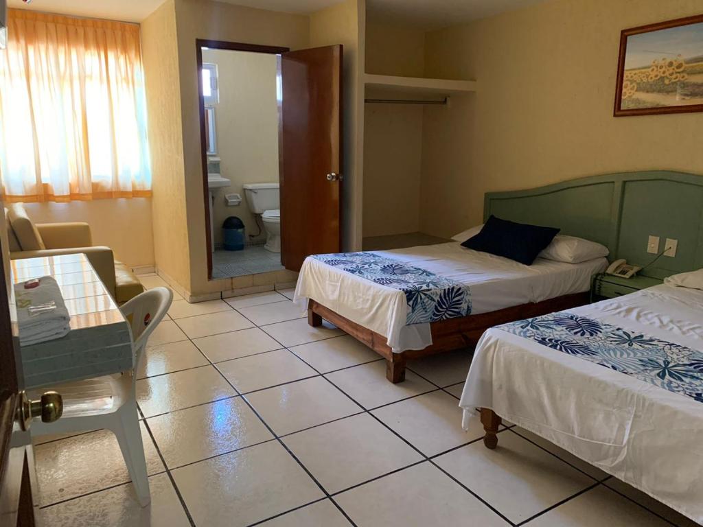 Postel nebo postele na pokoji v ubytování Hotel Jar8 Boca -Cerca WTC y plazas comerciales-