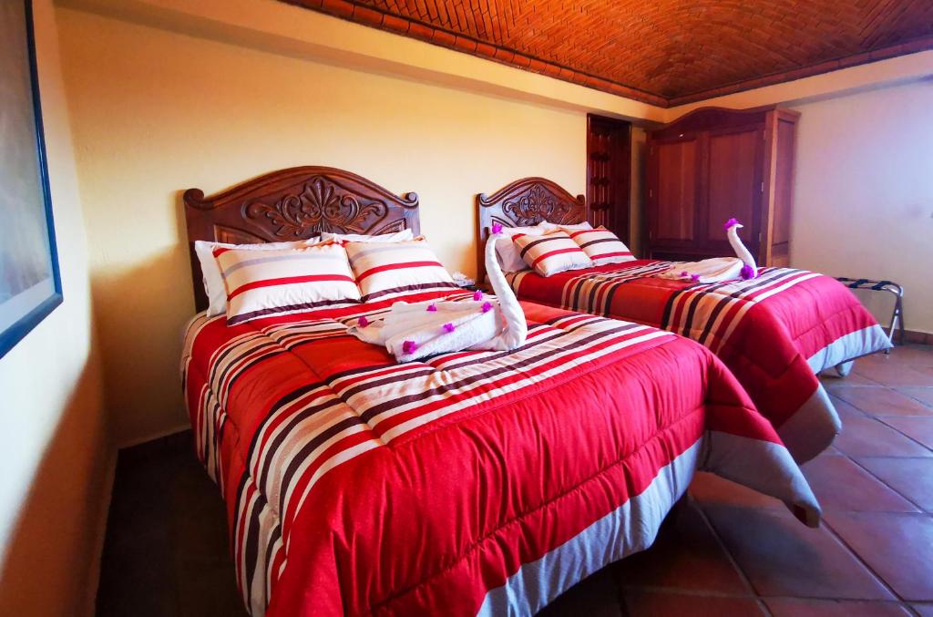 Postel nebo postele na pokoji v ubytování Hotel Chocolate Deluxe
