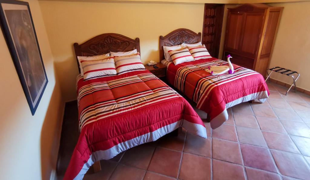 Postel nebo postele na pokoji v ubytování Hotel Chocolate Deluxe