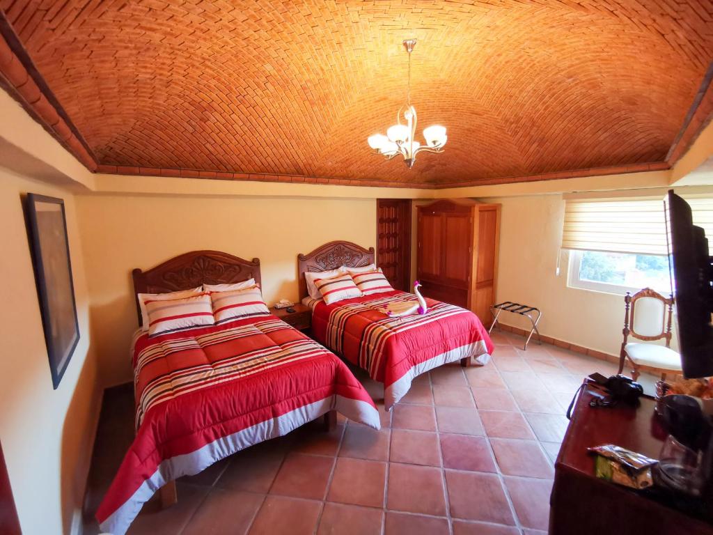 Postel nebo postele na pokoji v ubytování Hotel Chocolate Deluxe