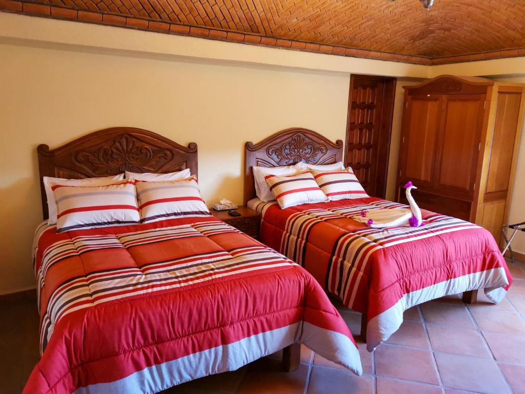 Postel nebo postele na pokoji v ubytování Hotel Chocolate Deluxe