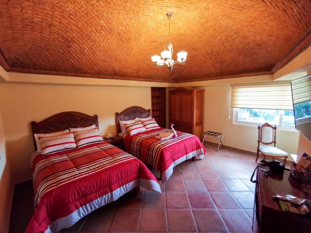 Postel nebo postele na pokoji v ubytování Hotel Chocolate Deluxe