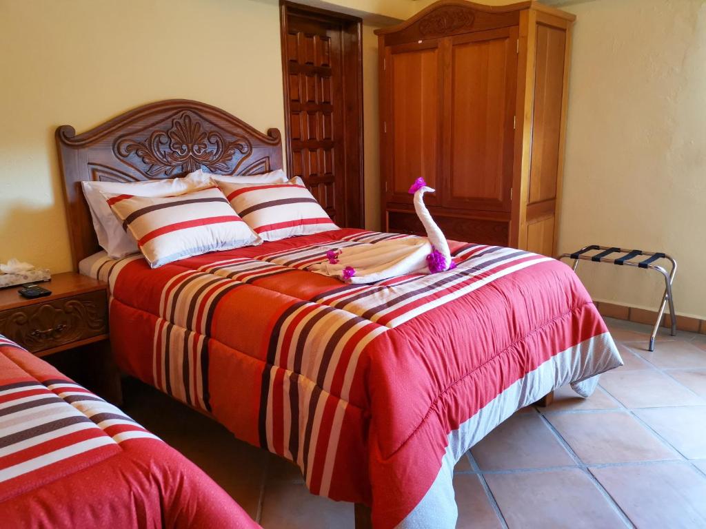 Postel nebo postele na pokoji v ubytování Hotel Chocolate Deluxe
