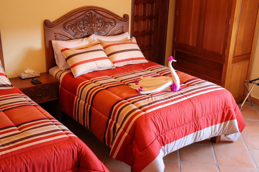 Postel nebo postele na pokoji v ubytování Hotel Chocolate Deluxe