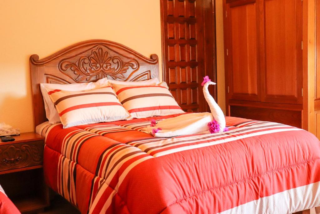 Postel nebo postele na pokoji v ubytování Hotel Chocolate Deluxe